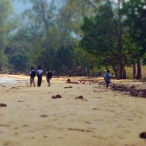 boys going home from school, through the jungle and the beach